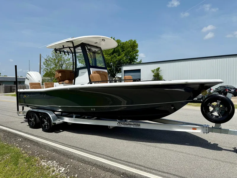 Slide: The Image of 2026 Sea Hunt BX 25 FS boat on trailer, parked outdoors under clear sky. - 5