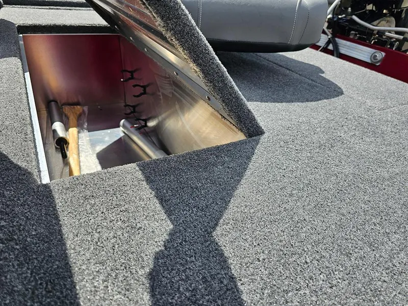 Slide: The Image of Open storage compartment in 2026 Tracker Bass Tracker Classic XL boat. - 11