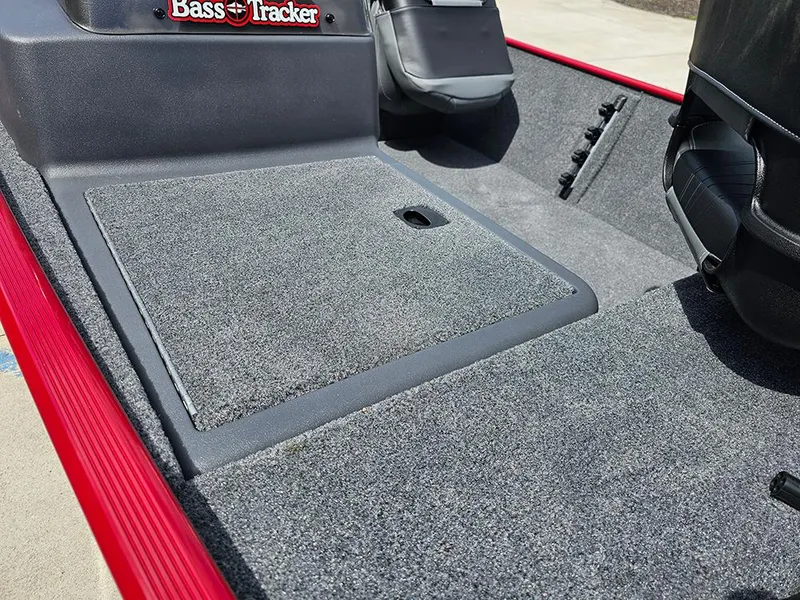 Slide: The Image of 2026 Tracker Bass Tracker Classic XL boat interior with gray carpet and seating. - 14
