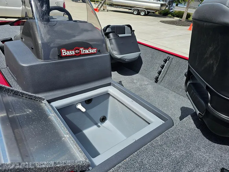 Slide: The Image of 2026 Tracker Bass Tracker Classic XL boat interior with storage compartment and seating. - 15