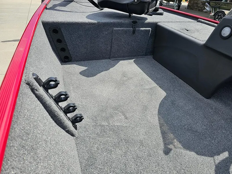 Slide: The Image of 2026 Tracker Bass Tracker Classic XL interior with rod holders and carpeted deck. - 18