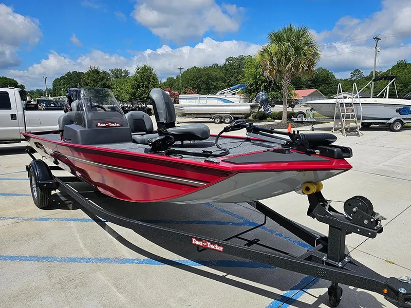 Slide: The Image of 2026 Tracker Bass Tracker Classic XL boat on trailer, parked outdoors under blue sky. - 5