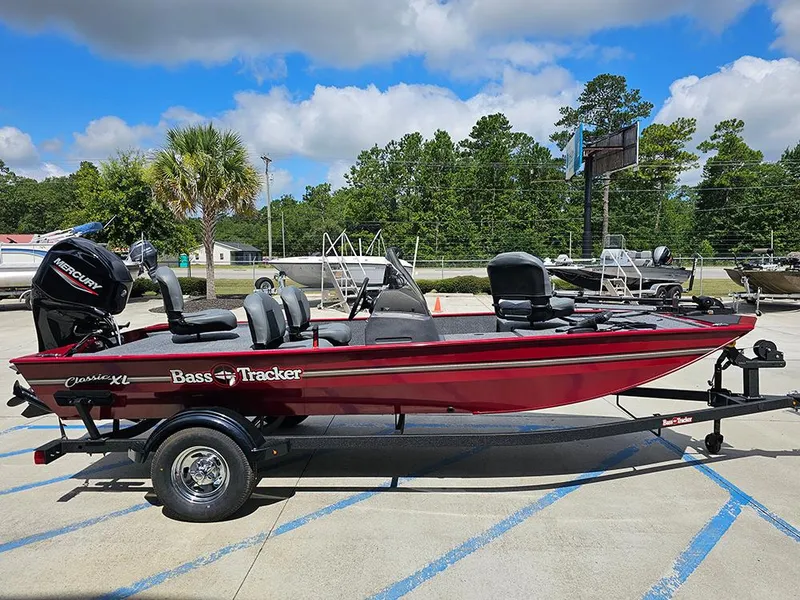 Slide: The Image of 2026 Tracker Bass Tracker Classic XL boat on trailer, parked outdoors under blue sky. - 6