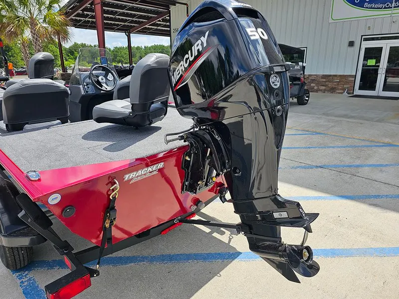 Slide: The Image of 2026 Tracker Bass Tracker Classic XL with Mercury outboard motor in outdoor setting. - 9