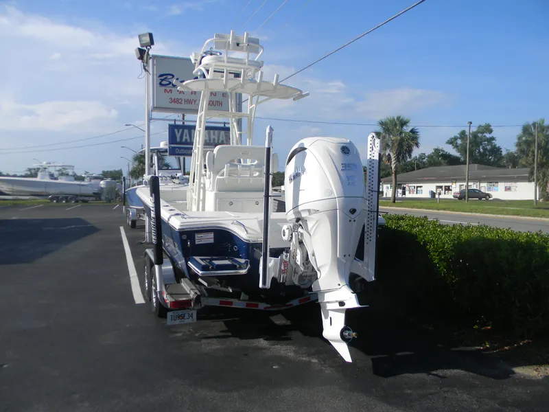 Slide: The Image of 2026 Pathfinder 2500 Hybrid boat with Yamaha outboard motor on a trailer. - 2
