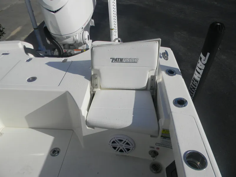 Slide: The Image of 2026 Pathfinder 2500 Hybrid boat seat with motor and rod holders. - 6