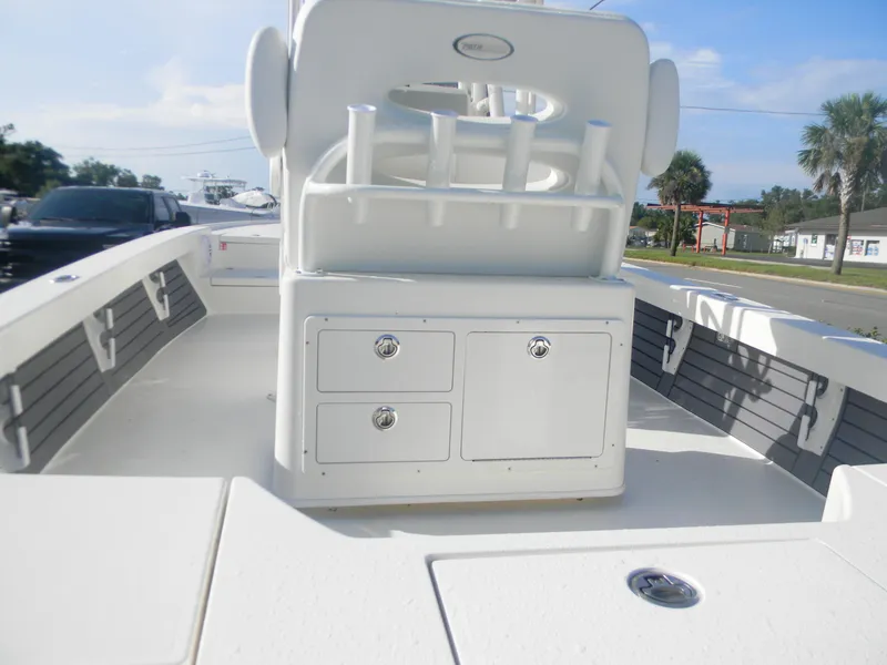 Slide: The Image of 2026 Pathfinder 2500 Hybrid boat interior with storage compartments and rod holders. - 7
