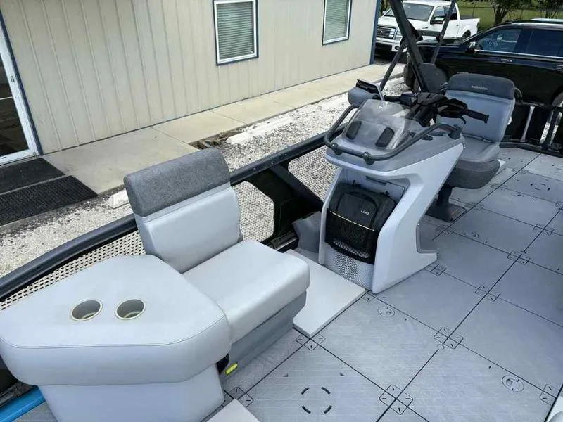Slide: The Image of 2022 Sea-Doo SWITCH SPORT 21 boat interior with seating and steering console. - 11