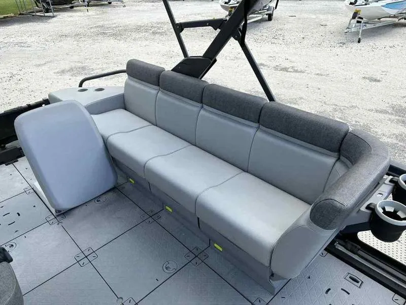 Slide: The Image of 2022 Sea-Doo SWITCH SPORT 21 boat interior with gray seating and cup holders. - 13
