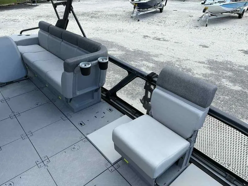 Slide: The Image of 2022 Sea-Doo SWITCH SPORT 21 interior with gray seating and cup holders. - 9