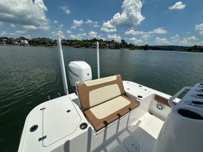 Slide: The Image of 2023 Caymas 26 HB boat on a lake with scenic shoreline view. - 17