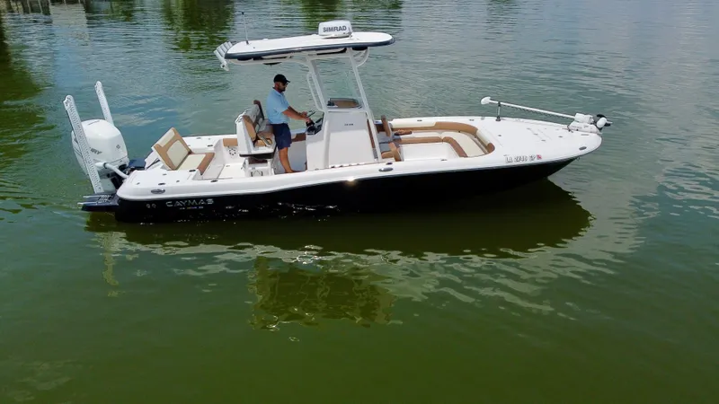 Slide: The Image of 2023 Caymas 26 HB boat on calm water, featuring a sleek design and modern amenities. - 6