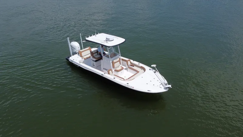 Slide: The Image of 2023 Caymas 26 HB boat on calm water, featuring sleek design and modern amenities. - 9