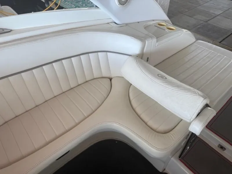 Slide: The Image of Luxurious white seating on a 2001 Cobalt 360 boat interior. - 12
