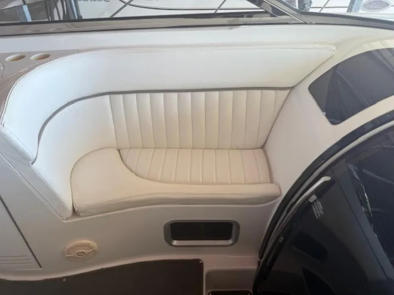 Slide: The Image of White leather seating on a 2001 Cobalt 360 boat interior. - 14