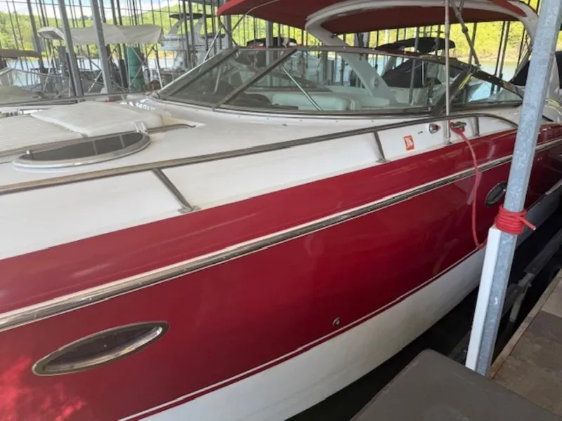Slide: The Image of Red and white 2001 Cobalt 360 boat docked in a marina. - 5