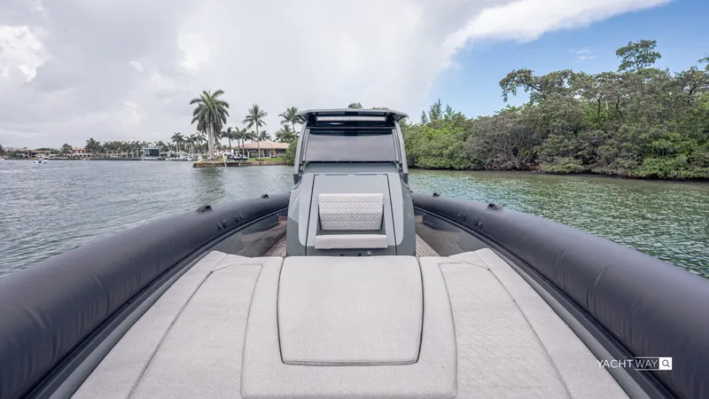 Slide: The Image of 2025 Skipper-BSK 38NC luxury yacht on serene waterway with lush greenery. - 15