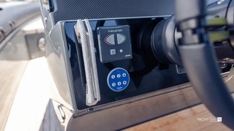 Slide: The Image of Control panel of 2025 Skipper-BSK 38NC yacht, featuring thruster and steering wheel. - 32