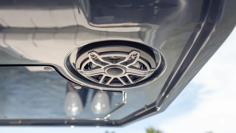 Slide: The Image of Speaker on Skipper-BSK 38NC boat, 2025 model, with sleek metallic design. - 36