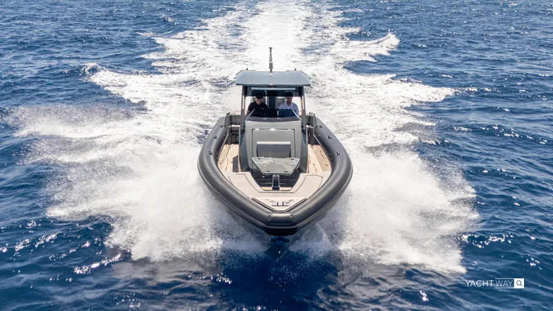 Slide: The Image of 2025 Skipper-BSK 38NC boat cruising on open sea, creating a dynamic water trail. - 4
