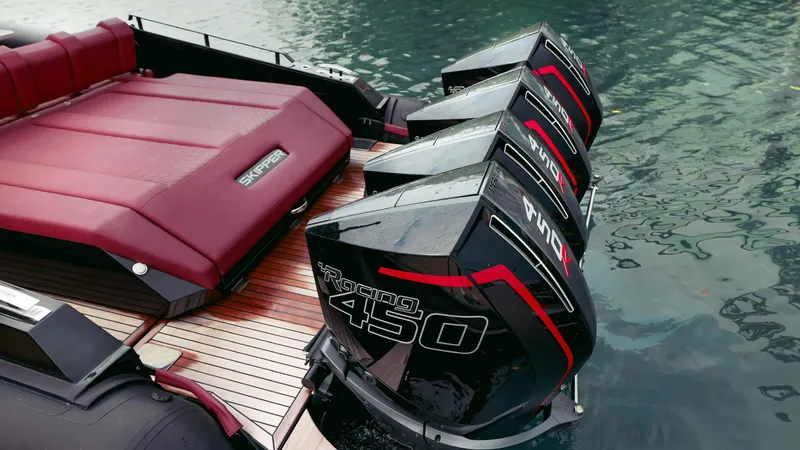 Slide: The Image of Luxury Skipper-BSK 42NC 2025 boat with powerful quad outboard engines on water. - 19