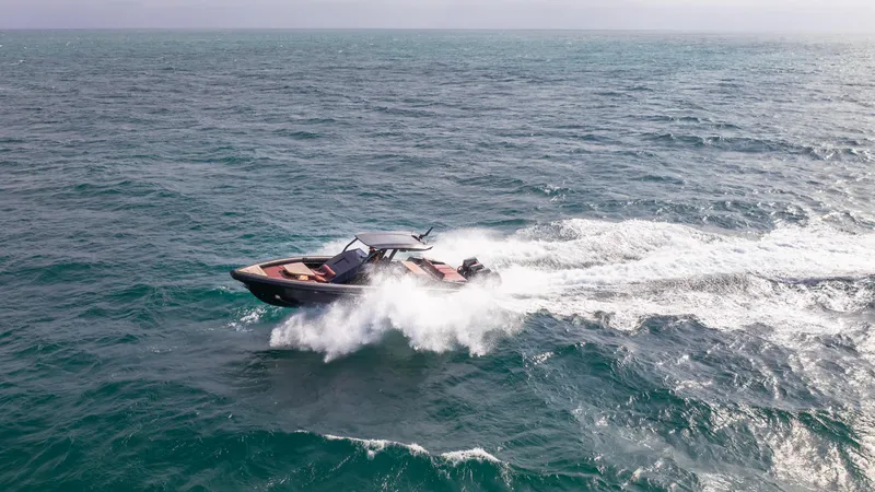 Slide: The Image of 2025 Skipper-BSK 42NC speedboat cruising on open sea, creating dynamic waves. - 5