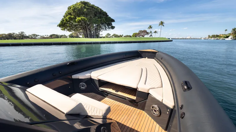 Slide: The Image of Luxurious 2025 Skipper-BSK 38NC boat with elegant seating, cruising on a serene waterway. - 7