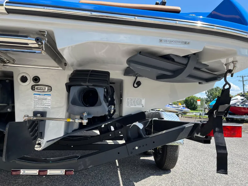 Slide: The Image of 2025 Yamaha Boats 222XD rear view, showcasing jet propulsion system and trailer attachment. - 3