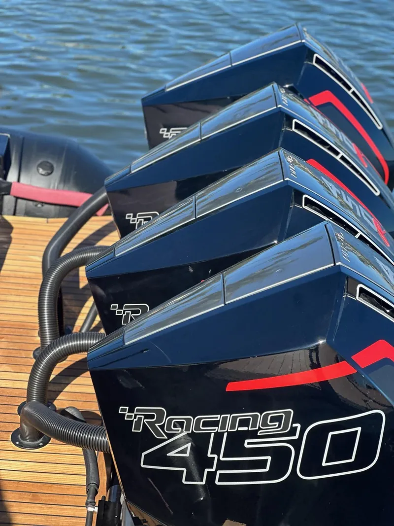 Slide: The Image of Four powerful Racing 450 outboard motors on a Skipper-BSK 42NC, 2025 model, by the water. - 20