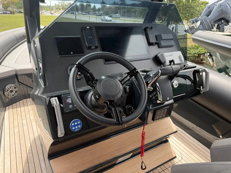 Slide: The Image of Helm of 2025 Skipper-BSK 38NC boat with modern controls and steering wheel. - 14