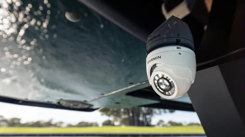 Slide: The Image of Security camera on Skipper-BSK 38NC boat, 2025 model, with water and landscape background. - 25