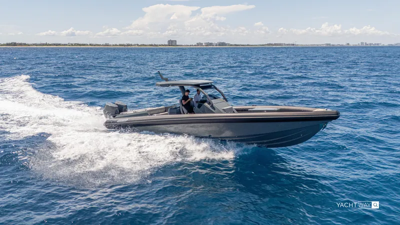 Slide: The Image of 2025 Skipper-BSK 38NC boat cruising on open sea under clear skies. - 3