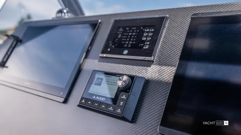 Slide: The Image of Control panel of 2025 Skipper-BSK 38NC yacht with JL Audio system and digital displays. - 37