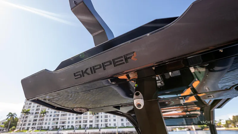 Slide: The Image of Skipper-BSK 38NC 2025 boat detail with modern design and cityscape background. - 22