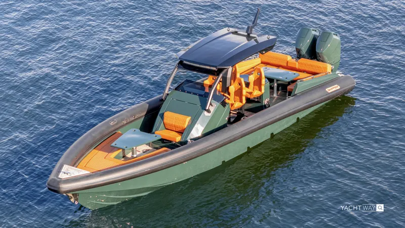 Slide: The Image of 2025 Skipper-BSK 38NC boat with orange seating, floating on calm blue water. - 9