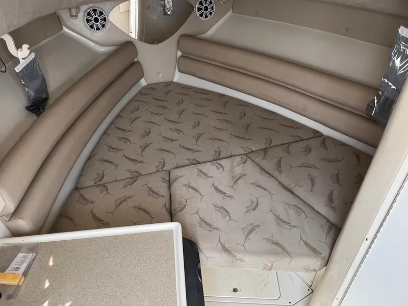 Slide: The Image of Interior cabin of 2003 Hydra-Sports Vector 2800 WA with cushioned seating and marine-themed upholstery. - 10