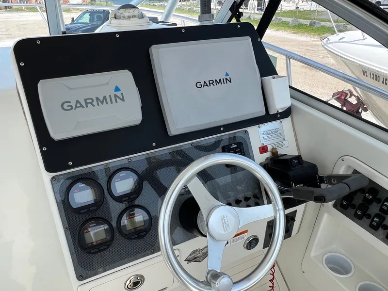 Slide: The Image of 2003 Hydra-Sports Vector 2800 WA dashboard with Garmin navigation and control instruments. - 5