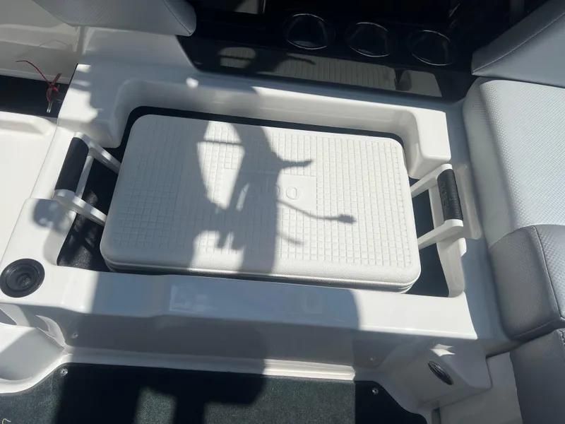 Slide: The Image of 2020 MasterCraft NXT20 boat interior with integrated cooler and seating area. - 15