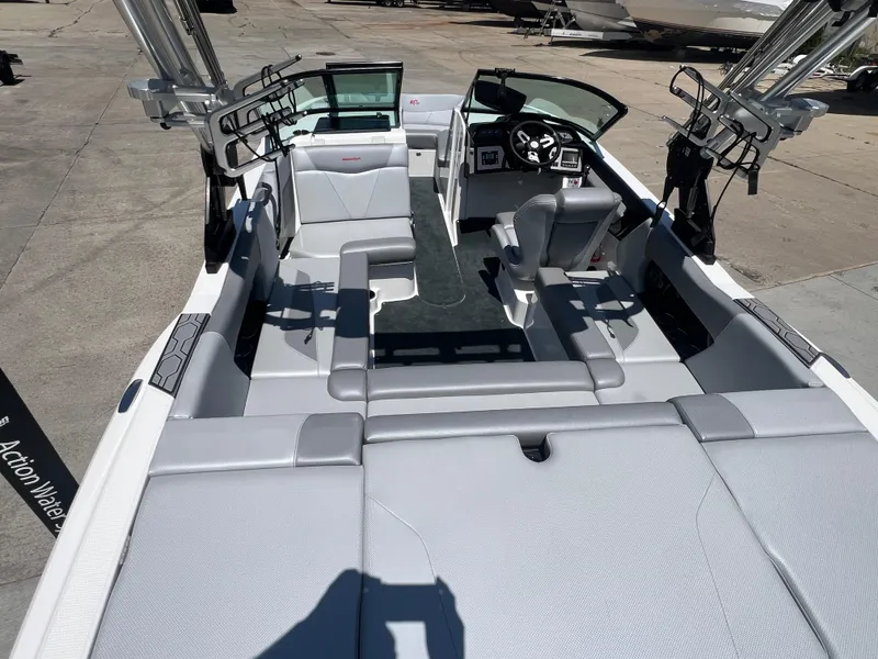Slide: The Image of 2020 MasterCraft NXT20 boat interior with sleek seating and modern dashboard. - 6