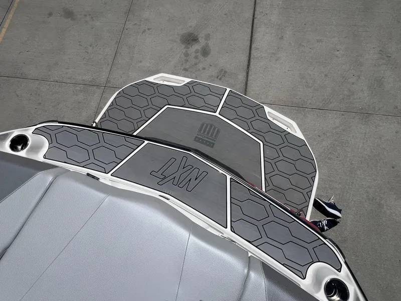 Slide: The Image of 2020 MasterCraft NXT20 boat with hexagonal pattern deck, viewed from above. - 7