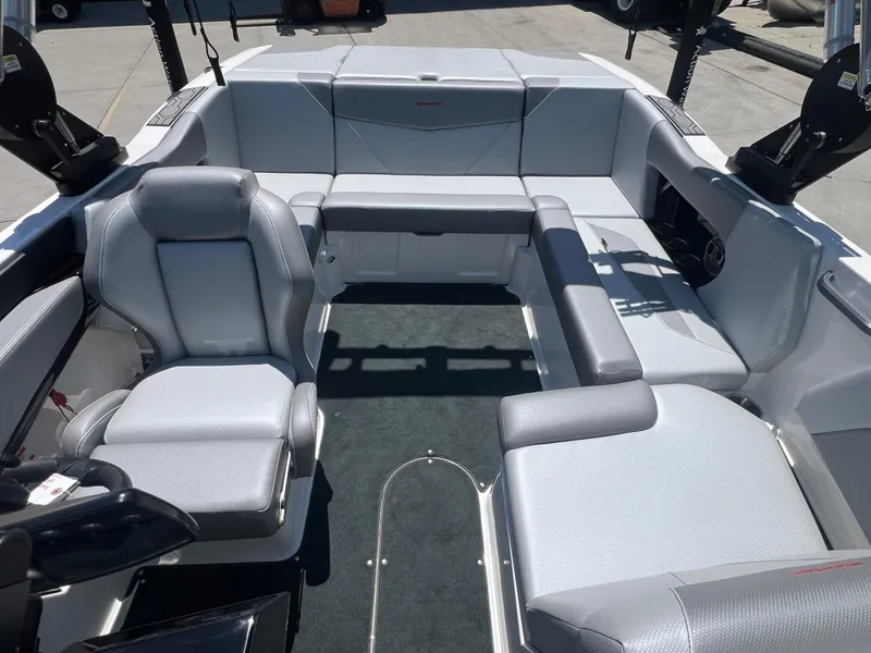 Slide: The Image of 2020 MasterCraft NXT20 boat interior with gray seating and spacious layout. - 9