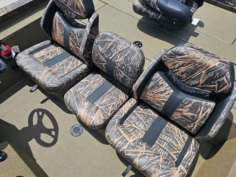 Slide: The Image of 2026 G3 Sportsman 1710 boat seats with camouflage pattern and steering wheel. - 12