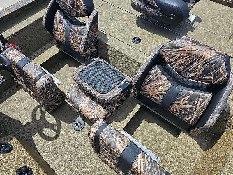 Slide: The Image of 2026 G3 Sportsman 1710 boat interior with camo-patterned seats and spacious layout. - 14