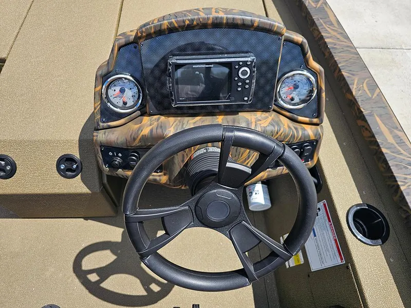 Slide: The Image of Dashboard of 2026 G3 Sportsman 1710 boat with steering wheel and gauges. - 15