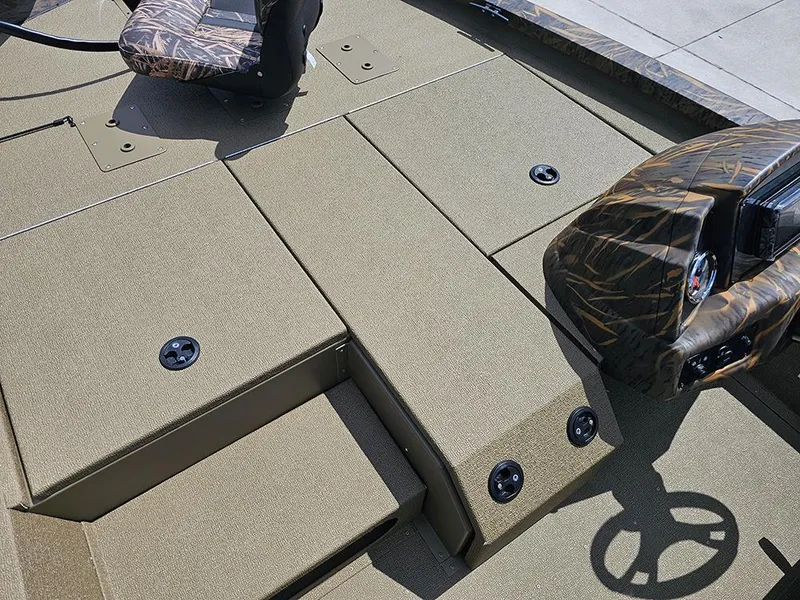 Slide: The Image of 2026 G3 Sportsman 1710 boat interior with camo seat and steering console. - 17