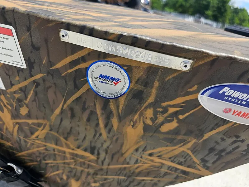 Slide: The Image of 2026 G3 Sportsman 1710 boat with camouflage design and certification stickers. - 21