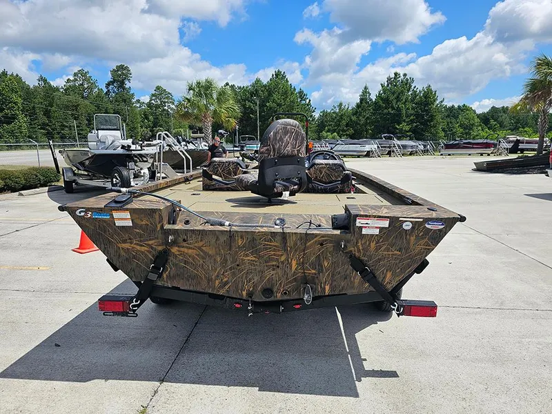 Slide: The Image of 2026 G3 Sportsman 1710 boat with camouflage design in outdoor showroom. - 7