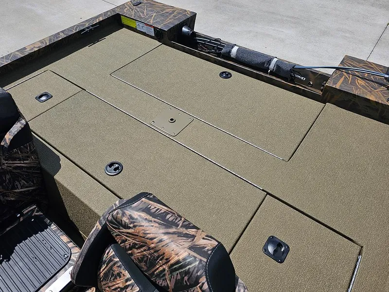 Slide: The Image of 2026 G3 Sportsman 1710 boat deck with camo seats and storage compartments. - 8