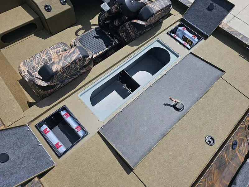 Slide: The Image of 2026 G3 Sportsman 1710 boat interior with camo seats and storage compartments. - 9