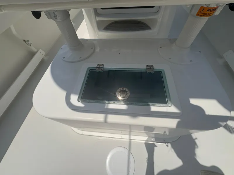 Slide: The Image of 2021 Parker 2300 Special Edition boat interior with storage compartment. - 12